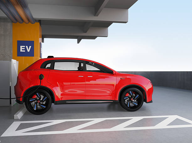 istock Red electric SUV recharging in parking garage 601378400