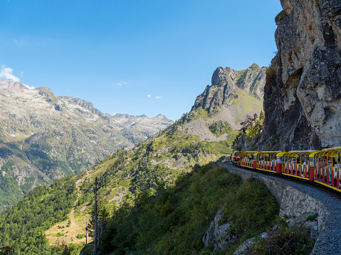 train of Artouste with cliffs in the french mountains Pyrenees