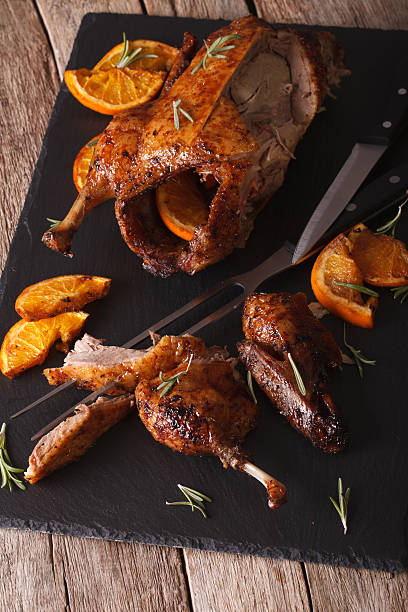 istock Sliced roasted duck closeup on a slate board on table 601379614