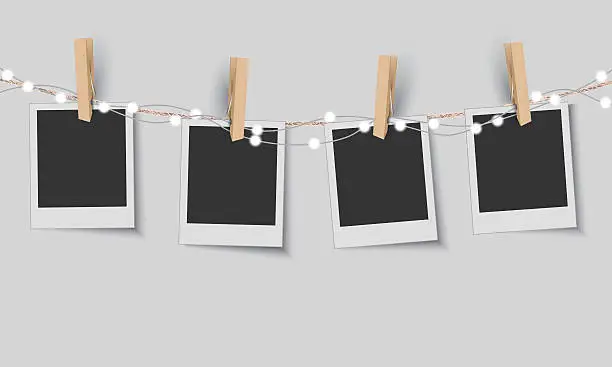 Vector illustration of Blank photo frames with fairy lights