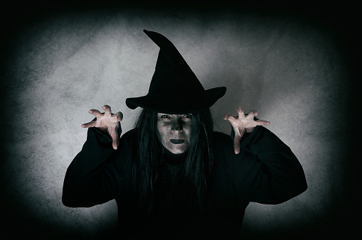 Halloween witch. Low key. Computer added dirt, scratches, grain and vignette.