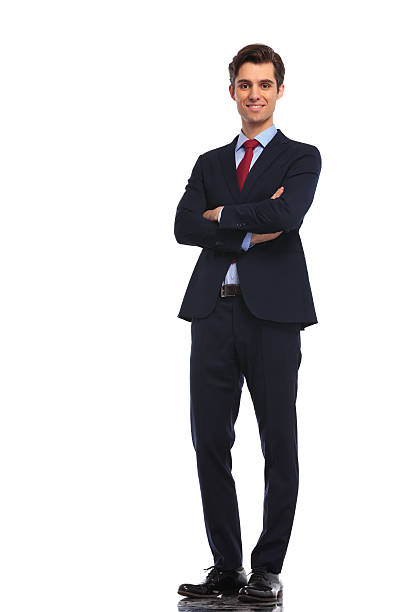 istock successful young business man standing with hands crossed 601380352