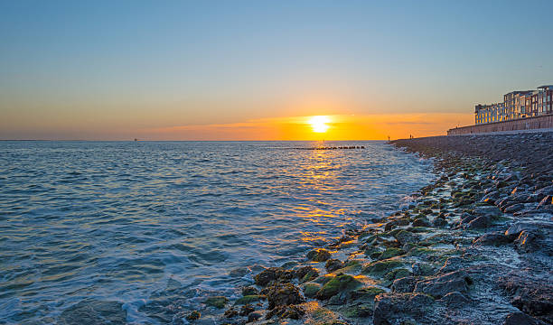 istock Sunset over a stormy sea in summer 601380530