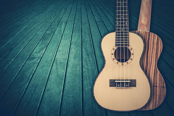part of a blue acoustic guitar on a wooden background. - musica sertaneja imagens e fotografias de stock