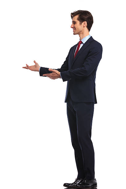 istock side of a young smiling business man presenting 601380662
