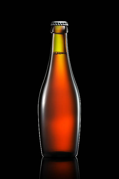 istock Bottle of beer or cider isolated on black background 601382028