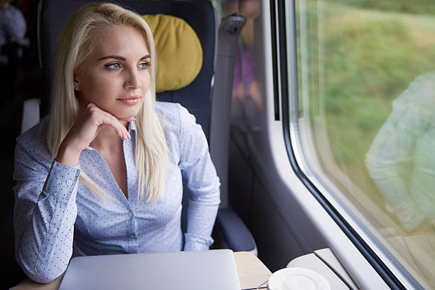 istock Pensive woman at the train 601382172