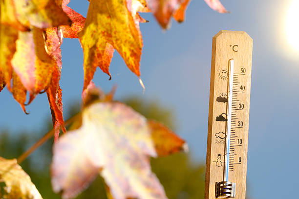 istock nice weather in the autumn shown with mercury thermometer 601382632