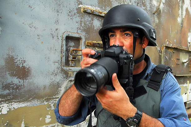 Photojournalist documenting war and conflict stock photo