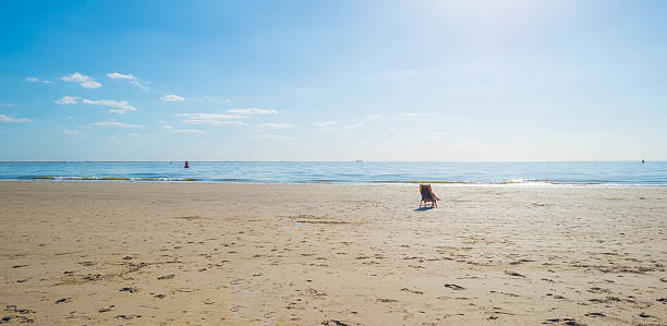 Blue sky over a beach along the sea stock photo