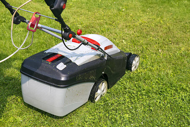 istock lawn-mower electric on green grass 601383100