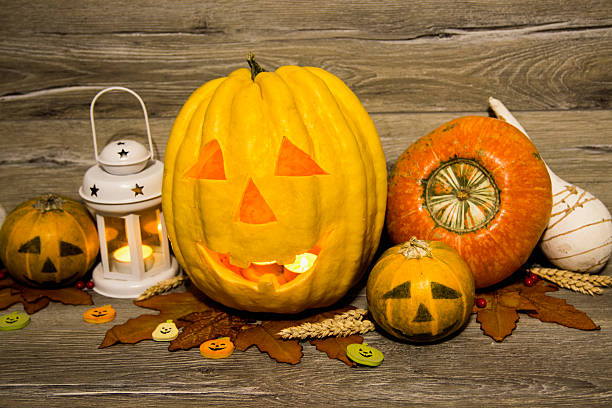 istock Halloween pumpkin head jack lantern on wooden background 601383692