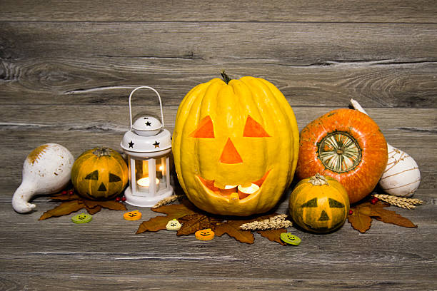 istock Halloween pumpkin head jack lantern on wooden background 601383848
