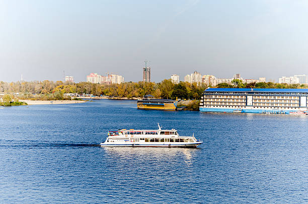 istock White cruise boat on the river. 601384848