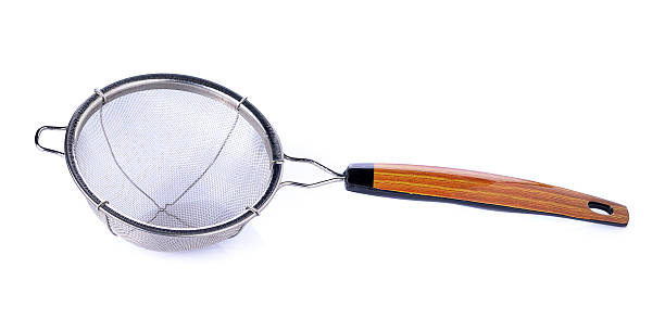 istock Metal sieve a wood handle isolated on white background 601385200