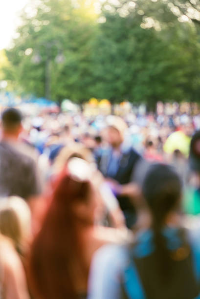 istock out of focus large crowd at outdoor event 601386676