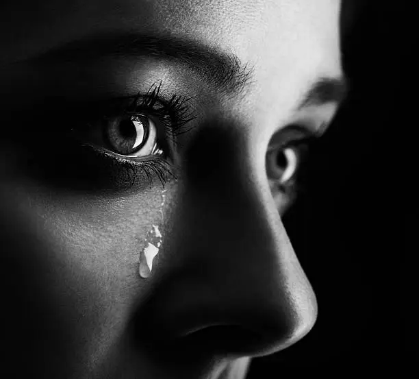 beauty girl cry on black background (height contrast film monochrom edit)
