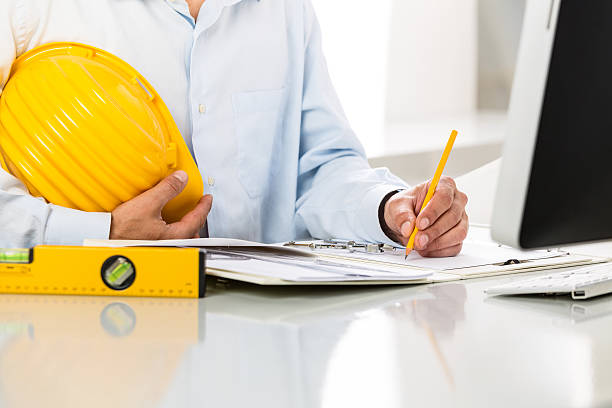 istock Close-up Of Architect Hands Using Metal Drawing Compass 601387082
