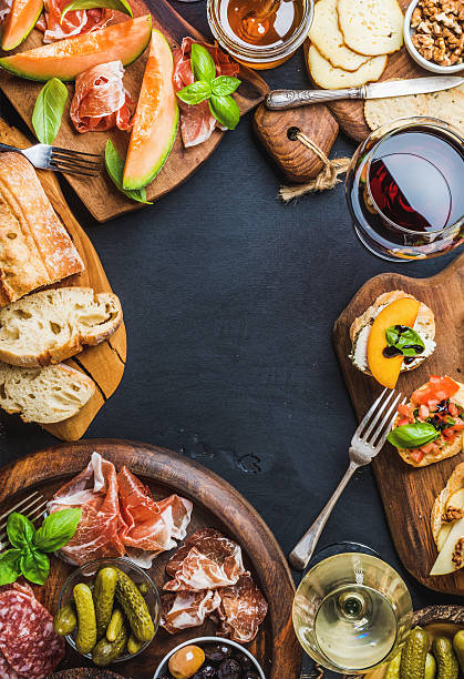 istock Italian antipasti wine snacks set over black grunge background 601387910