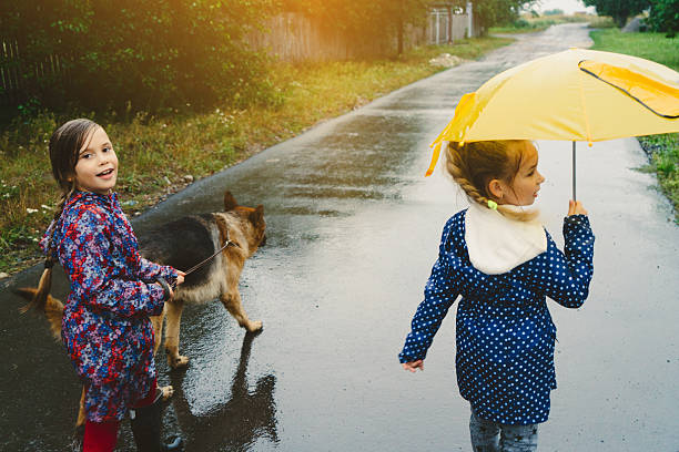 istock Girls walking with dog 601389818