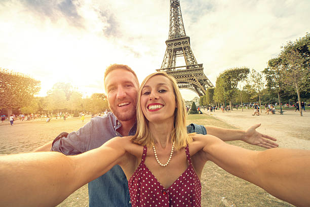 istock Couple taking a selfie in Paris under the Eiffel Tower 601391032