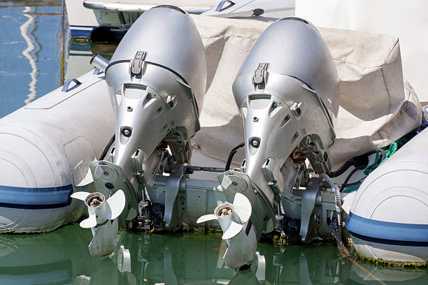 couple of outboard engines - outboard motor imagens e fotografias de stock