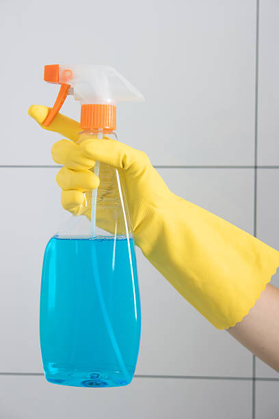 istock Detergent for the bathroom in hand housewife. 601391402