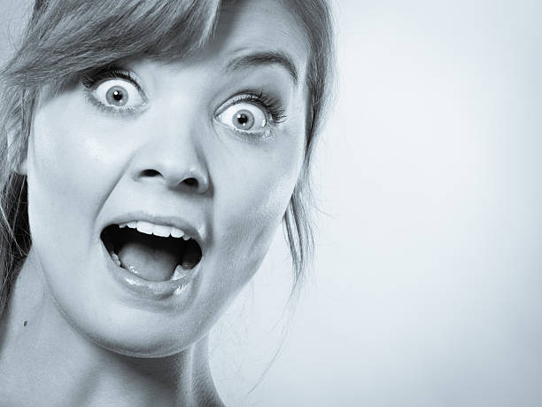 istock Surprised astonished girl with open mouth. 601391656
