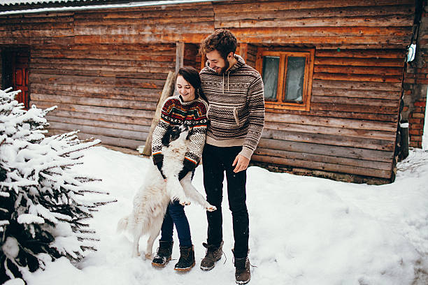 istock Couple  playing  with dog 601392560