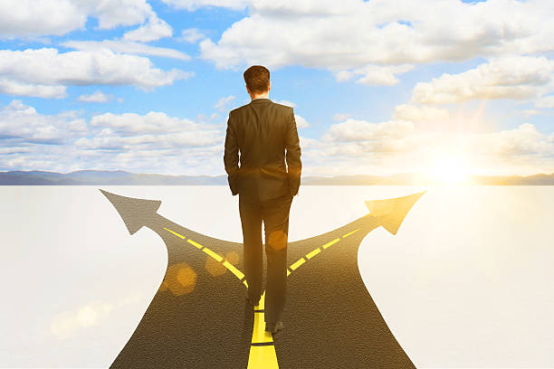 istock businessman standing on highway road 601393234