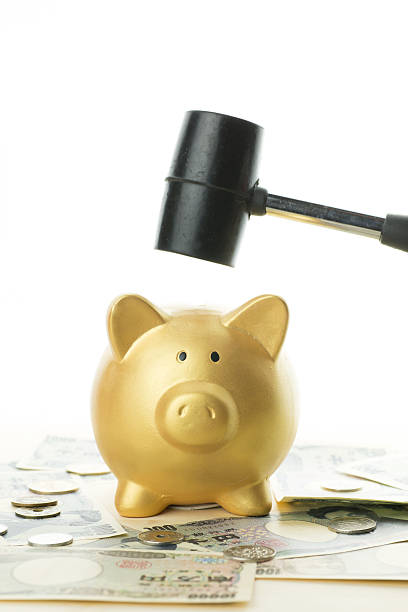 istock Piggy bank and hammer 601394130