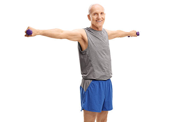 istock Mature man exercising with dumbbells 601397516