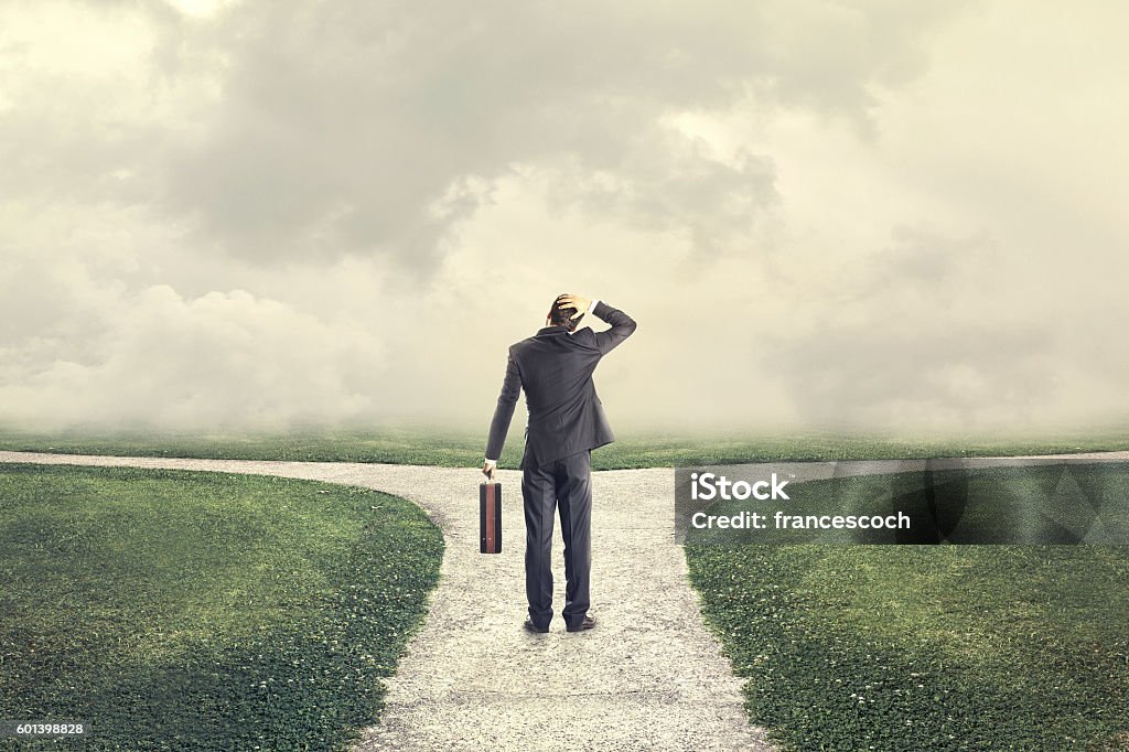 indecisive and lost man chooses the right path indecisive man and lost chooses the right path Choice Stock Photo