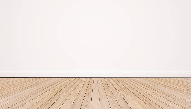 Oak wood floor with white wall stock photo
