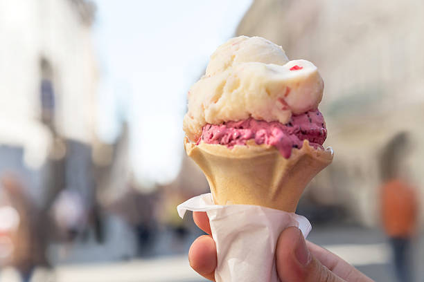 istock Ice cream cone held up in the Krakow (Cracow). Poland. 601401026