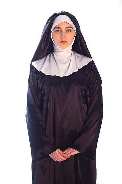 Catholic nun Photo of young catholic nun on white background. nun catholicism sister praying stock pictures, royalty-free photos & images