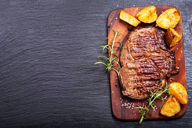 istock grilled meat with rosemary and vegetables 601401472