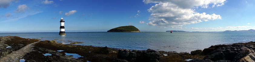 Panorama photograph showing Penmon Lighthouse, Anglesea, North Wales and Puffin Island, with Great Orme, Llandudno on the horizon.