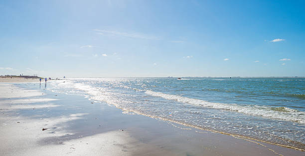 istock Blue sky over a beach along the sea 601401604
