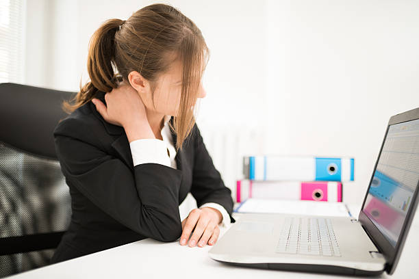 istock Businesswoman having cervical problem in the office 601402570