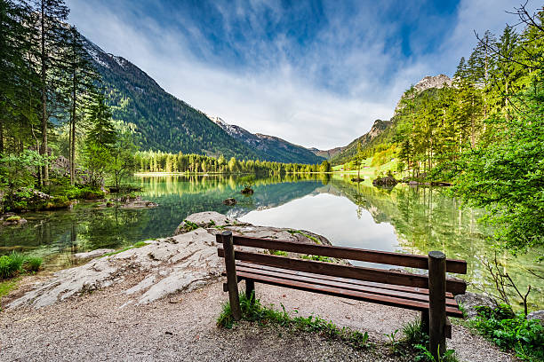 istock Small bench at the Hitersee lake in the Alps 601895808