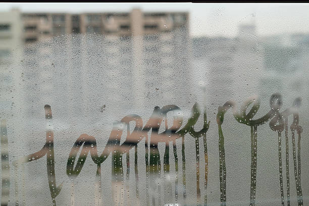istock Happiness text on window water dews 601897448