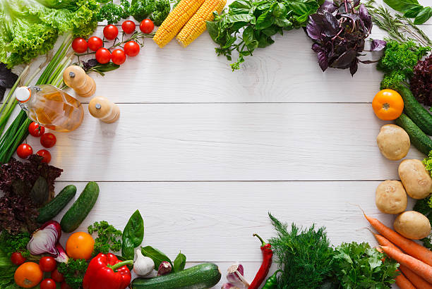 istock Fresh vegetables frame on white wood background with copy space 601897570