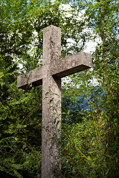 istock Christian Cross Marble with Green Trees 601898224