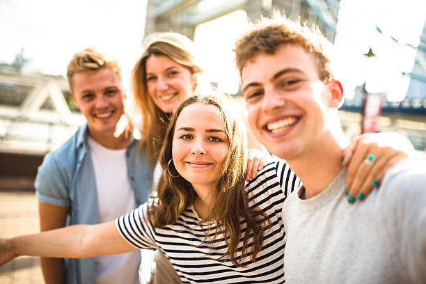 istock friends walking in london at tower bridge 601898398