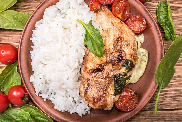 istock Spinach and cheese stuffed chicken breast with rice. 601900166