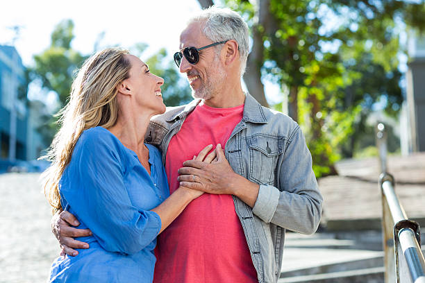 istock Romantic mature couple standing in city 601900876