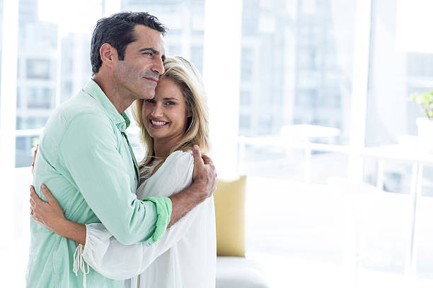 istock Romantic couple hugging at home 601901022
