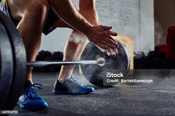 Closeup Of Weightlifter Clapping Hands Before Barbell Workout A Stock Photo - Download Image Now