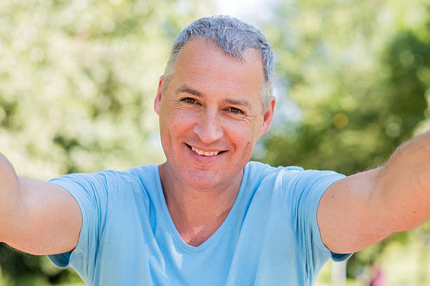 istock Selfie fun. Smiling mature man making selfie and grimacing 601902832